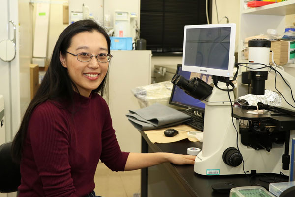 Picture of Leung Hei Man in her laboratory