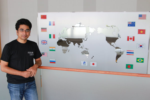 Pitcure of Amit Rai in front of a world map