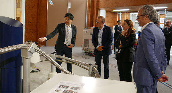image of Dr Imai explaining to Minister Obertin