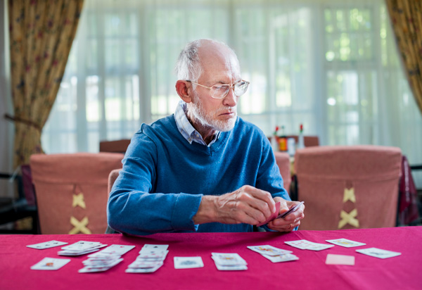 image of a man playing card game